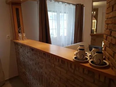a kitchen with a counter with three coffee cups on it at JOHN BEAUTY 50m2, METRO and ACROPOLIS 5' in Athens