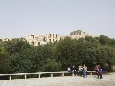 a group of people standing in front of a castle at JOHN BEAUTY 50m2, METRO and ACROPOLIS 5' in Athens