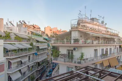 a group of buildings with balconies and plants on them at 5th flr Boho studio @ Exarheia w/ balcony in Athens