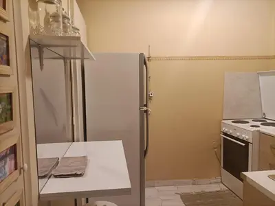a kitchen with a refrigerator and a stove at Charming Retreat in Athens