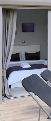 a bedroom with two beds and a mirror at Athens Riviera Loft in Athens
