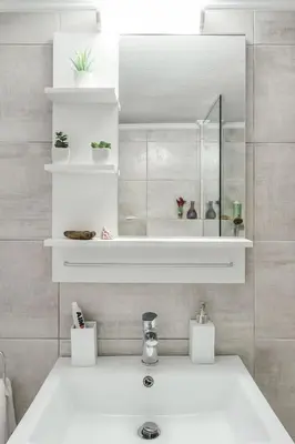a bathroom with a sink and a mirror at Koukaki Apartment with a Sunny Balcony, near the Acropolis in Athens