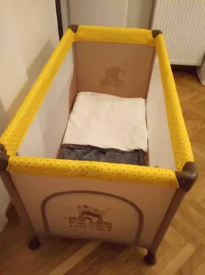 a small yellow and white cart with a mattress at 3BDR IDEAL CENTRAL ATHENIAN APT in Athens