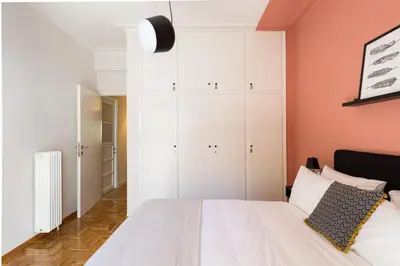 a bedroom with white cabinets and a bed at Urban Chic 1BD Apartment in Hilton district by UPSTREET in Athens