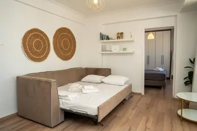 a bedroom with a bed in a room at V&V Acropolis view apartment in Athens