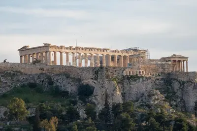 a building sitting on top of a mountain at V&V Acropolis view apartment in Athens