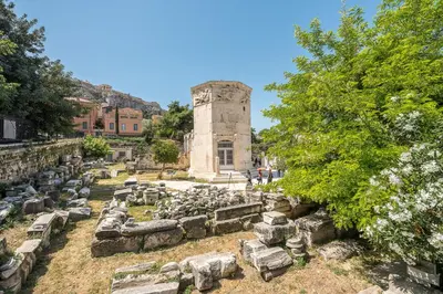 a group of ruins in front of a building at Just Under Acropolis in Athens