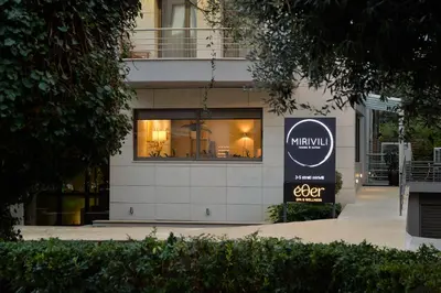 a store window with a sign in front of it at MIRIVILI hospitality & wellness in Athens