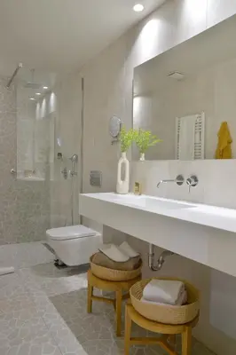 a bathroom with a sink and a toilet and a mirror at MIRIVILI hospitality & wellness in Athens