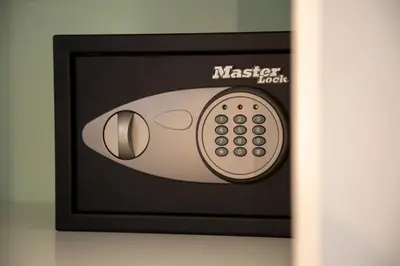 a microwave oven with a remote control on it at The Frogs_Guest House in Athens