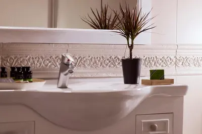 a bathroom sink with a potted plant on it at Plaka's Villa with Breathtaking Acropolis view in Athens