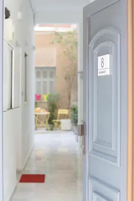 an open door with the number eight on it at Grandma's Chic & Bright Athenian home with a Patio in Athens