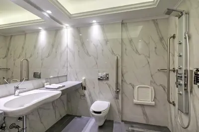 a bathroom with a sink and a shower at Estia Boutique Apartments in Athens