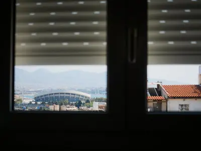 a view of a stadium from a window at 7th Floor Stunning View Penthouse in Piraeus in Piraeus