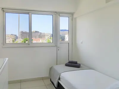 a white room with two beds and two windows at KYMA Apartments - Athens Acropolis 14 in Athens