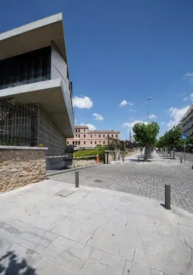 a building with a cobblestone street in front of a building at Attractive Flat near the Acropolis Museum & Metro Station by Athenian Homes in Athens
