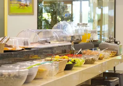a buffet line with many different types of food at Stefanakis Hotel & Apartments in Varkiza