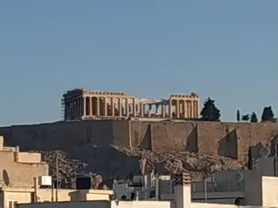 a view of the acropolis from the city of athens at Hotel @Syngrou Fix in Athens