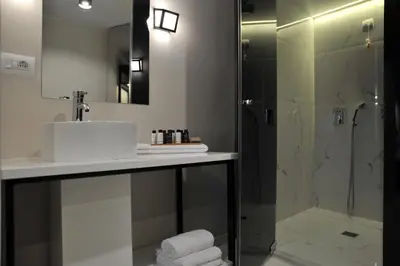 a bathroom with a sink and a shower at B4B Athens 365 in Athens