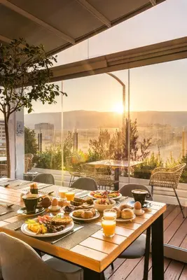 a wooden table with food on top of a balcony at B4B Athens 365 in Athens
