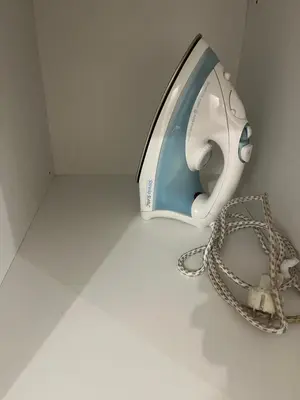a washing machine with a chain on a floor at Acropolis View in Athens
