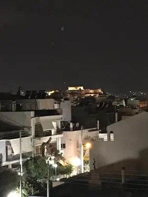 a view of a city at night with buildings at Acropolis View in Athens