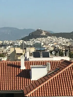 a view of a city from the roof of a building at Acropolis View in Athens
