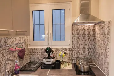 a kitchen counter with a sink and a window at Quality Home in Athens in Athens