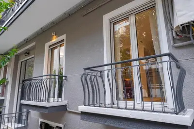 a balcony on the side of a house at Spacious Modern Apartment in Athens near Metro in Athens