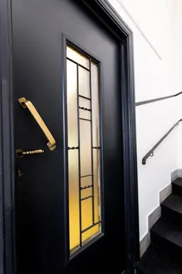 a black door with a window on a building at Soho Apartments in Athens