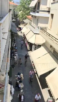 an overhead view of a street with people riding bikes at Adrianou 150 in Athens