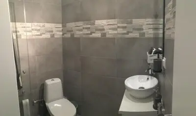 a bathroom with a toilet and a sink at Adrianou 150 in Athens
