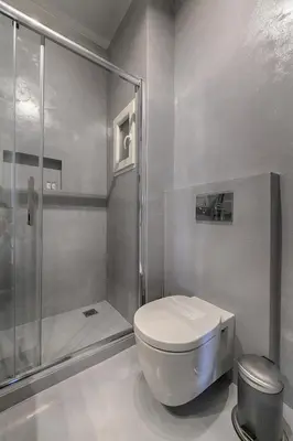 a bathroom with a toilet and a shower at Athens Grand Suite in Athens