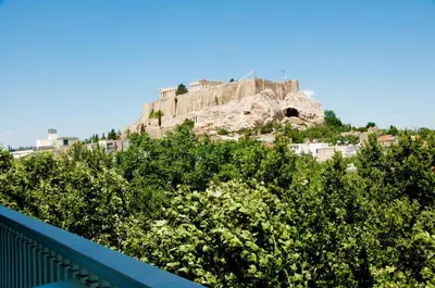 a castle on top of a hill with trees at Athens Grand Suite in Athens