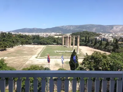 a view of a park from a balcony at Athens Grand Suite in Athens