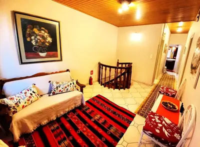 a living room with a couch and a rug at Villa 
