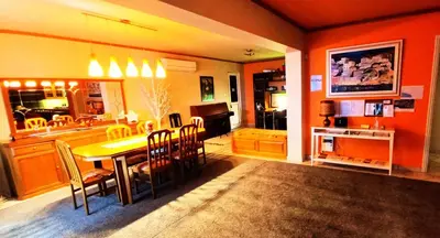 a kitchen and dining room with a table and chairs at Villa 