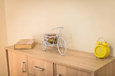a toy bike sitting on top of a dresser at Elegant Home in Quiet Street by Cloudkeys in Athens