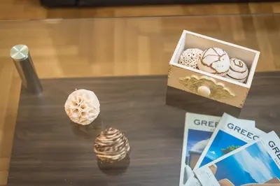 a table with a box of different types of desserts at Elegant Home in Quiet Street by Cloudkeys in Athens