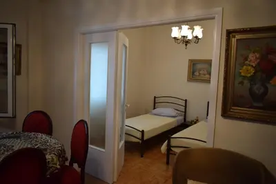 a room with a bedroom with a bed and a mirror at George apartment in Athens