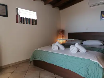 a bedroom with a bed with towels on it at Center gazi historical in Athens