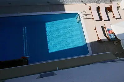 an overhead view of a swimming pool at Erato Hotel in Agia Marina Aegina