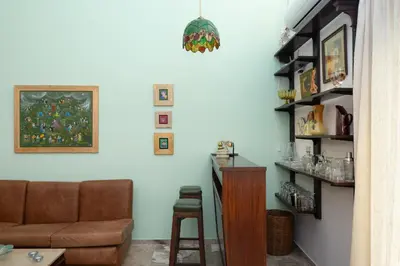 a living room with a couch and a table at Acropolis Koukaki Loft Private Garden in Athens