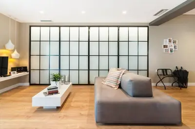 a living room with a couch and a table at Ma Maison No2 Luxury Suite, Parking, 200Mbps,Metro in Athens