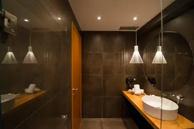a bathroom with a sink and a shower and a mirror at Ma Maison No2 Luxury Suite, Parking, 200Mbps,Metro in Athens