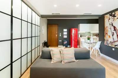 a living room with a couch and a red refrigerator at Ma Maison No2 Luxury Suite, Parking, 200Mbps,Metro in Athens