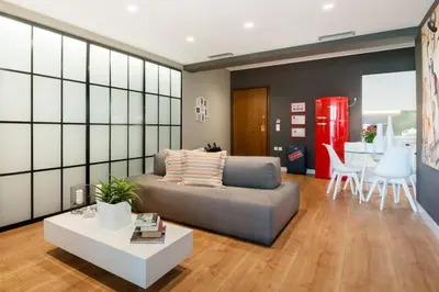 a living room with a couch and a table at Ma Maison No2 Luxury Suite, Parking, 200Mbps,Metro in Athens
