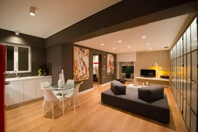 a living room with a couch and a glass table at Ma Maison No2 Luxury Suite, Parking, 200Mbps,Metro in Athens