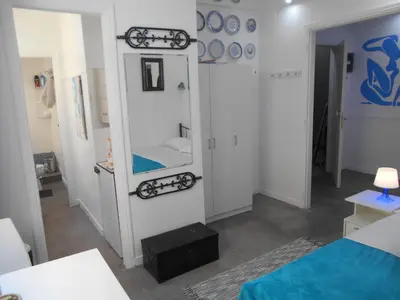 a room with a bed and a mirror at Monastiraki flea market & metro station appartment in Athens