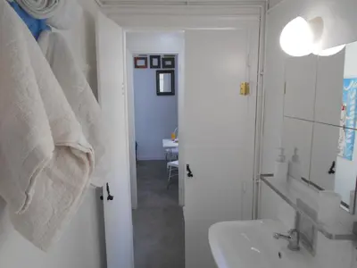 a bathroom with a sink and a bath tub at Monastiraki flea market & metro station appartment in Athens